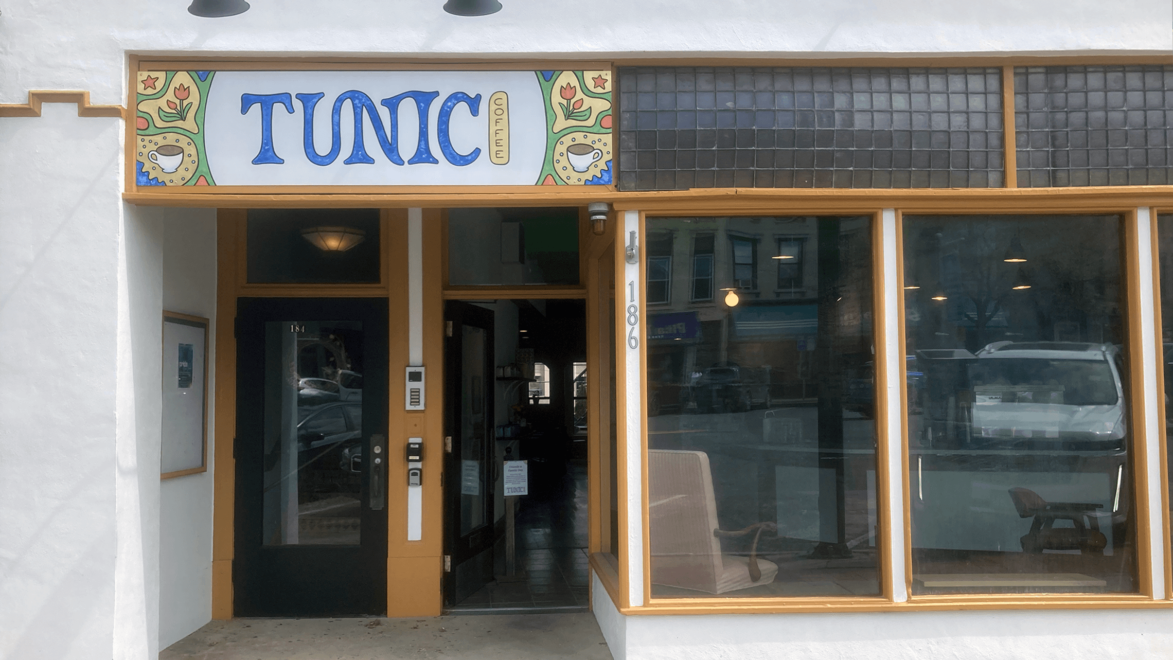 Storefront for TunicCoffee with handpainted sign