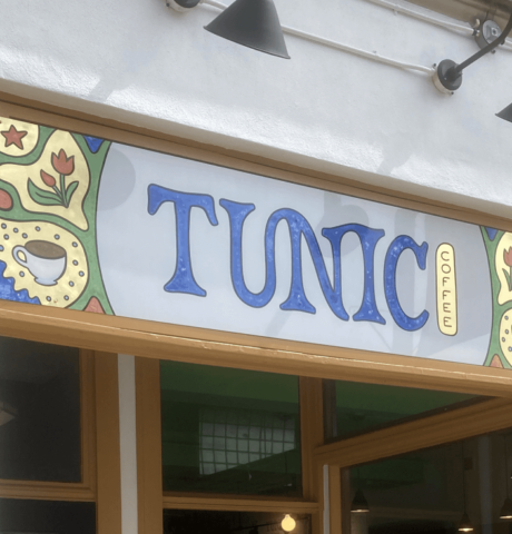 Hand-painted sign for Tunic Coffee with gold leaf