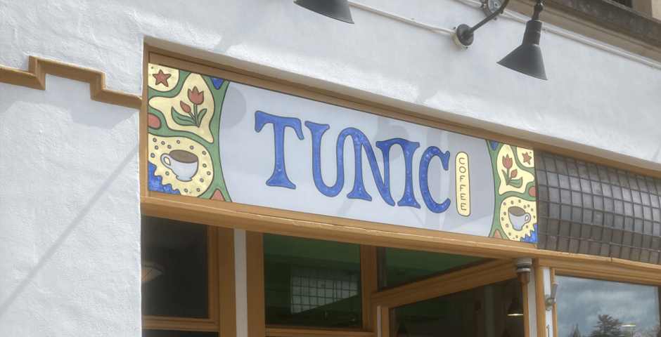 Hand-painted sign for Tunic Coffee with gold leaf