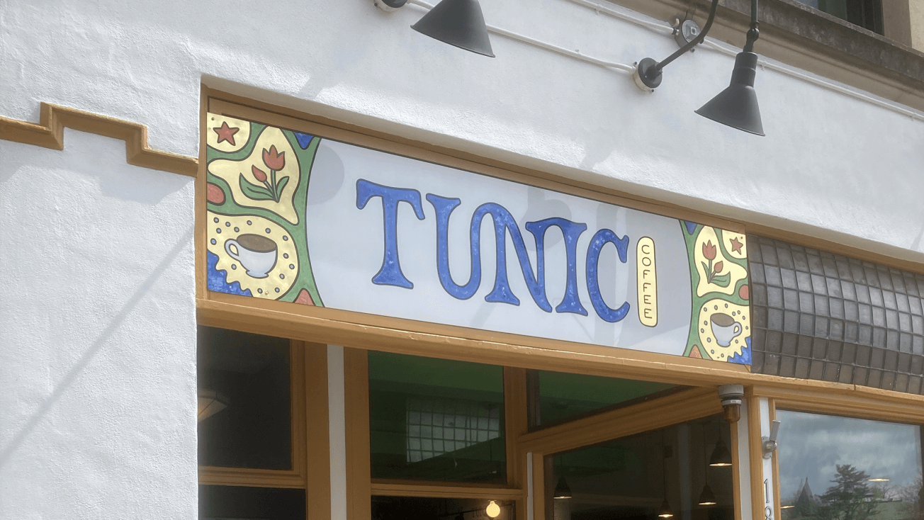 Hand-painted sign for Tunic Coffee with gold leaf